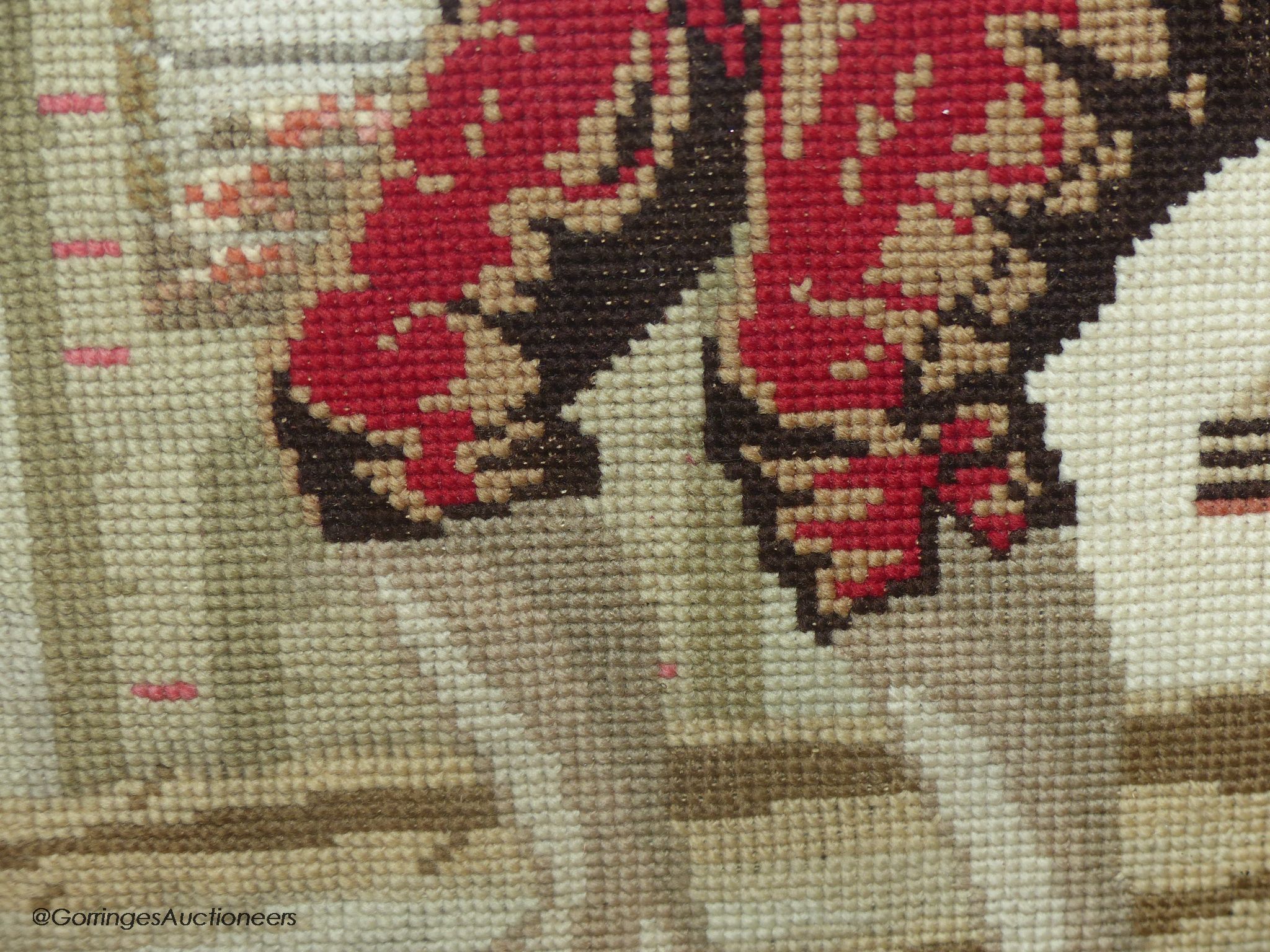 A Victoian petit-point needlework picture, two playful youths
